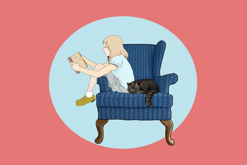 本を読む少女と猫