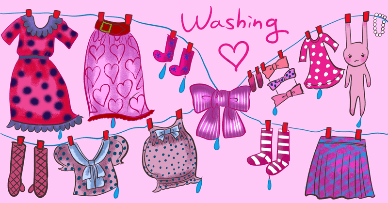 ピンクの背景に水玉やハート、フリルやレースを多用した衣類が干されているイラスト