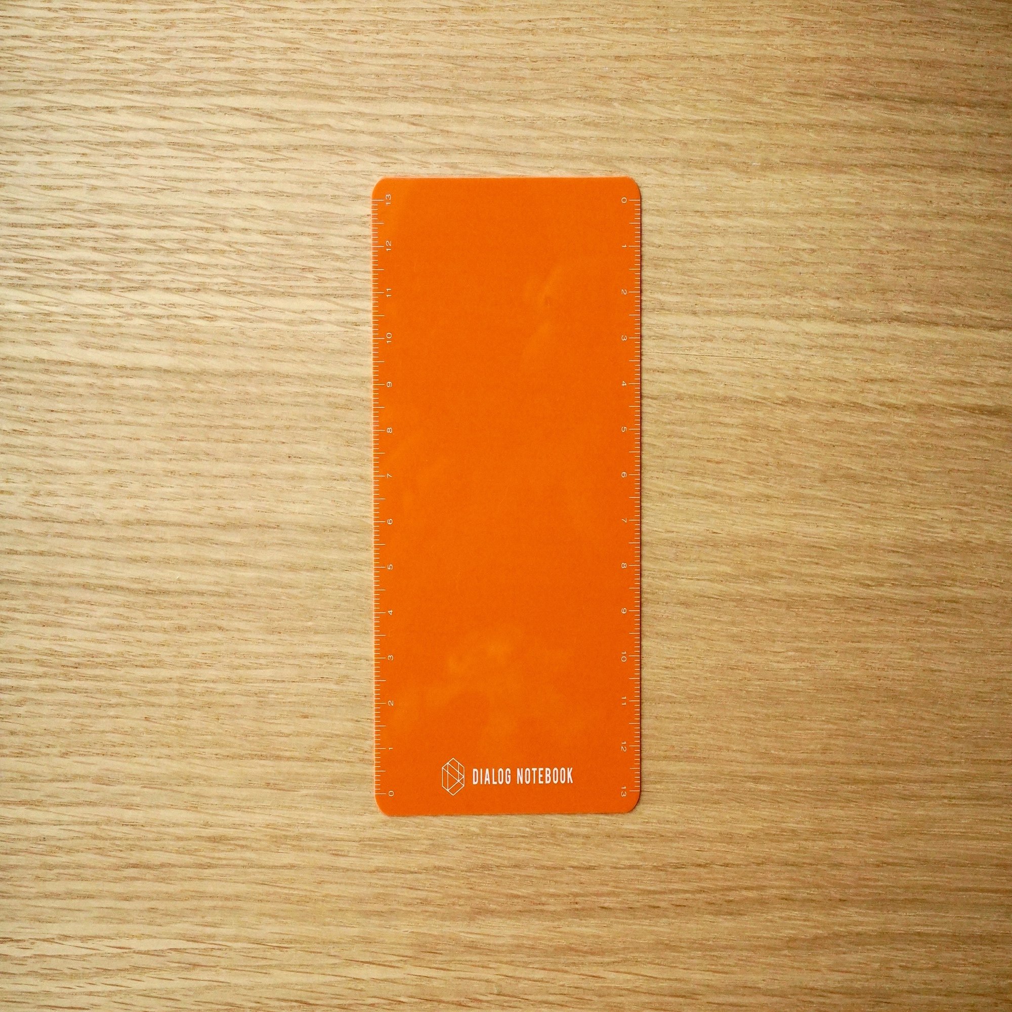 お知らせ Dn下敷き オレンジ 限定販売開始 Dialog Notebook ページ番号入りの小さな方眼ノート Note