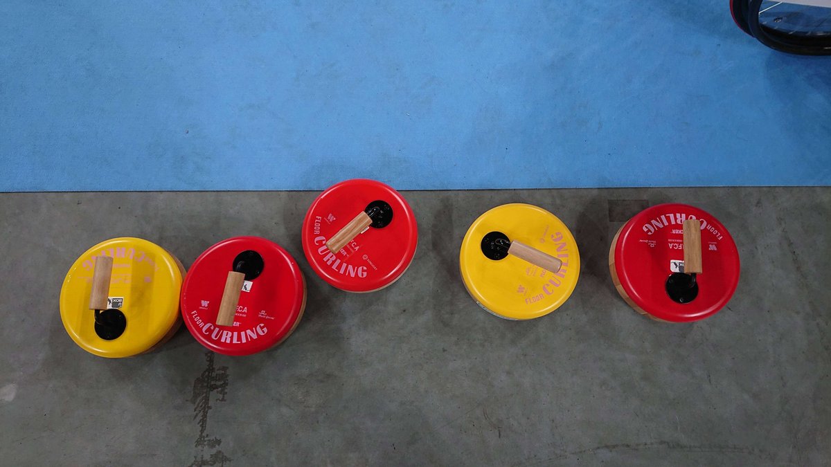 Indoor curling stones in red and yellow, pop and cute