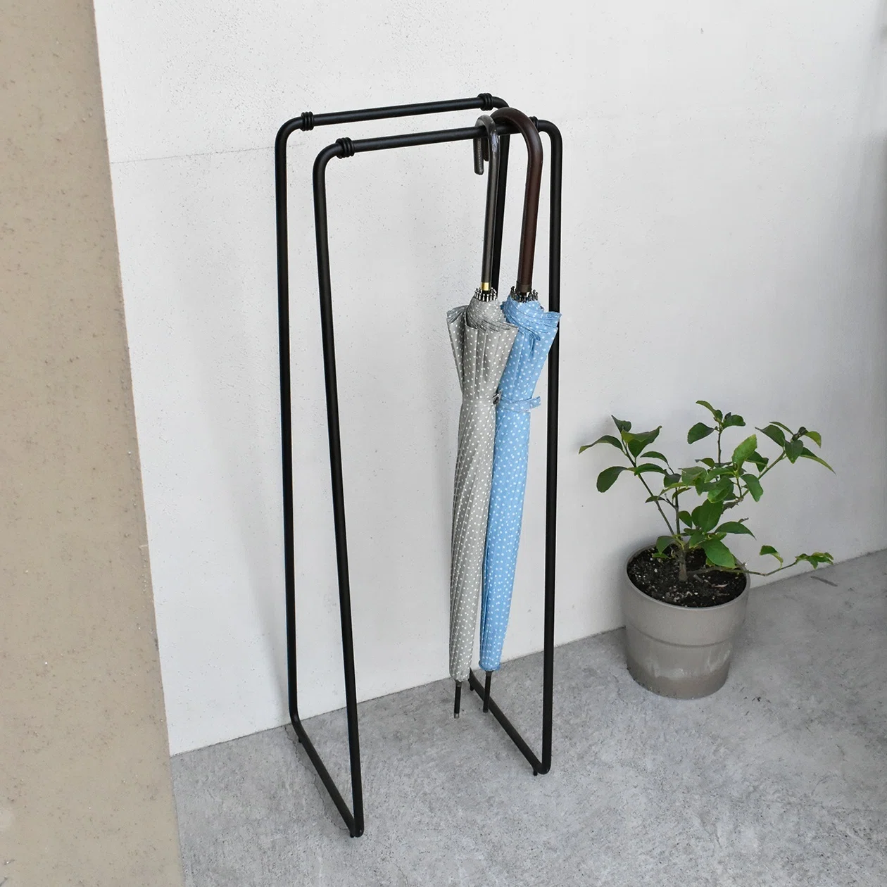 You obsessed over that? An umbrella hanger made to look like a