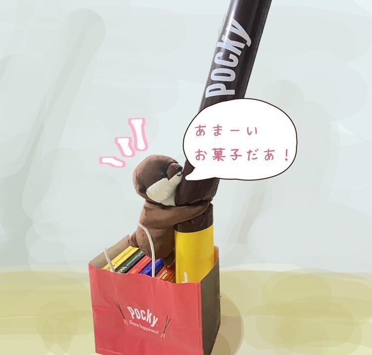 大きなポッキーに喜ぶカワウソ