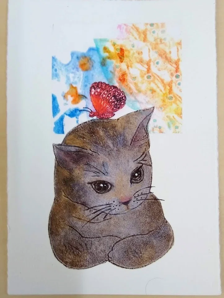 ネコの版画。顔を手描きで加筆したので、版画なのに違う顔になってる件 