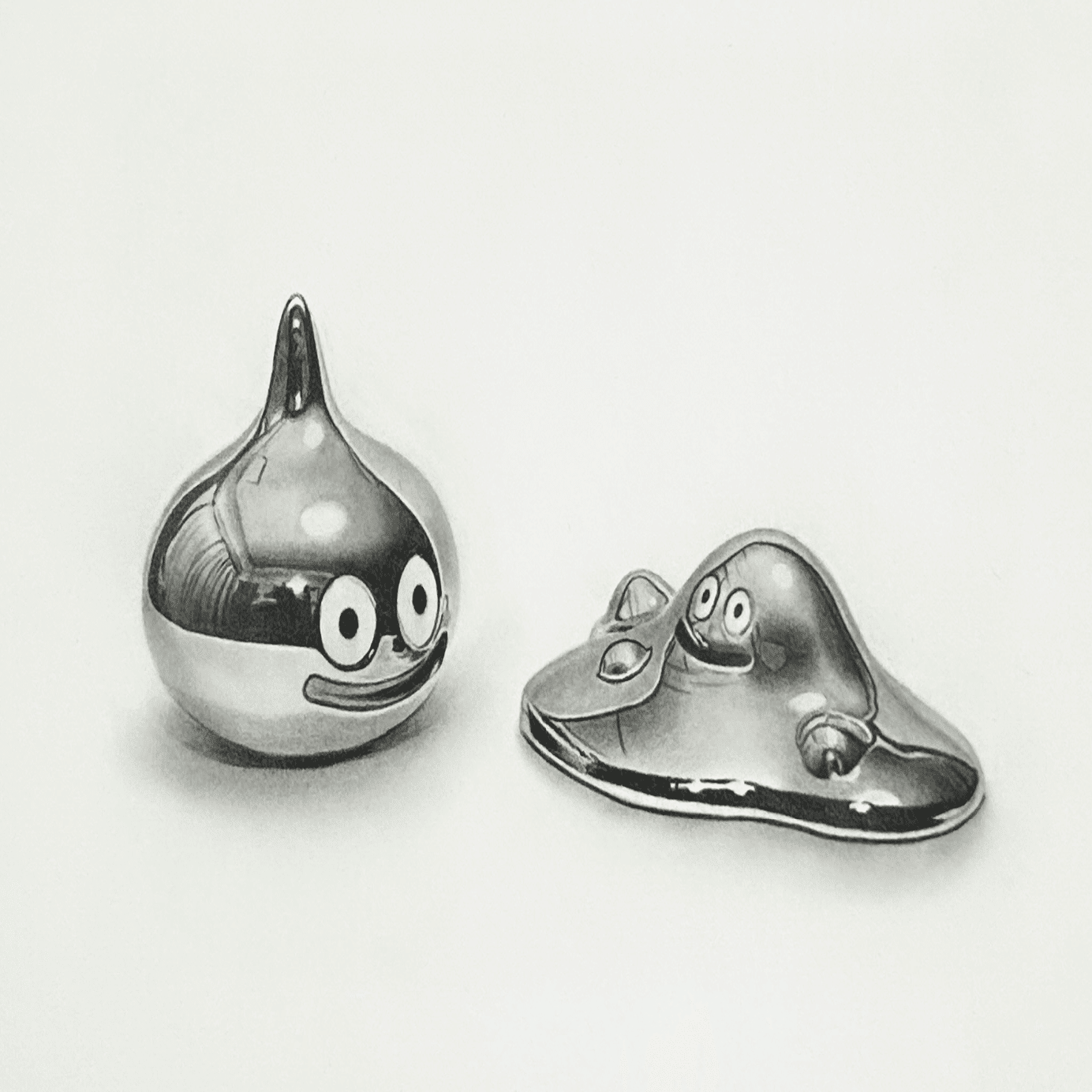 鉛筆で描いたメタルスライムとはぐれメタルです。｜ここまる