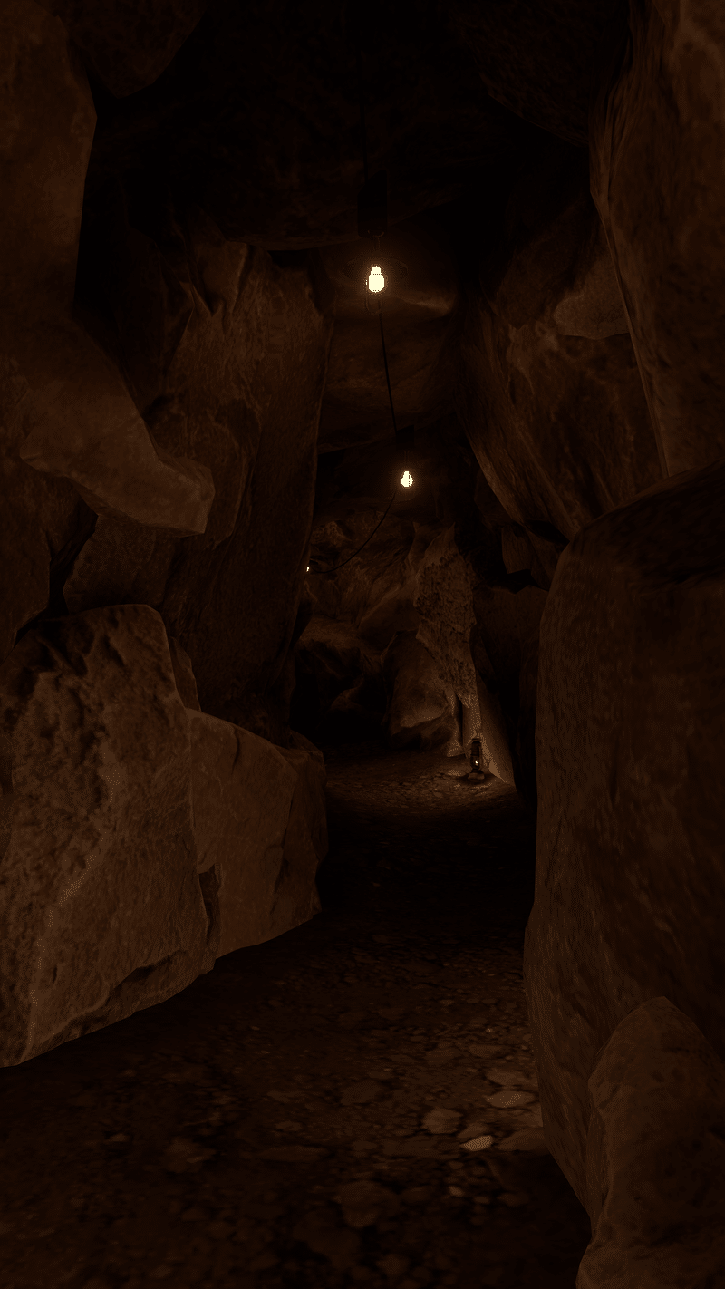 暗い洞窟。天井にある白熱電球が周りをほのかに照らす。床にはランタンもある。岩石質の壁