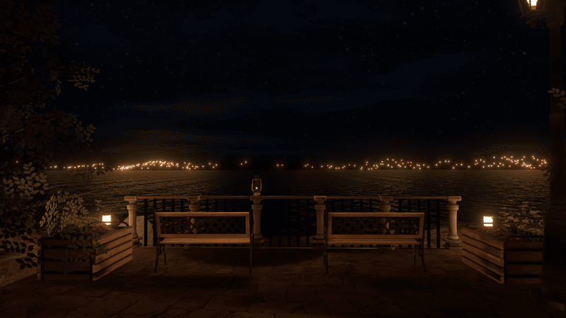 海を見渡すベンチ。海の向こうに夜景が見える