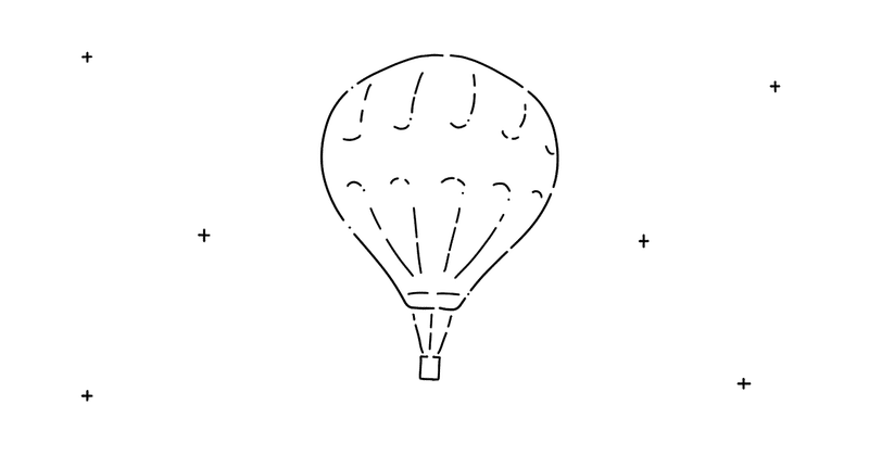 空に浮かぶ気球のイラスト。