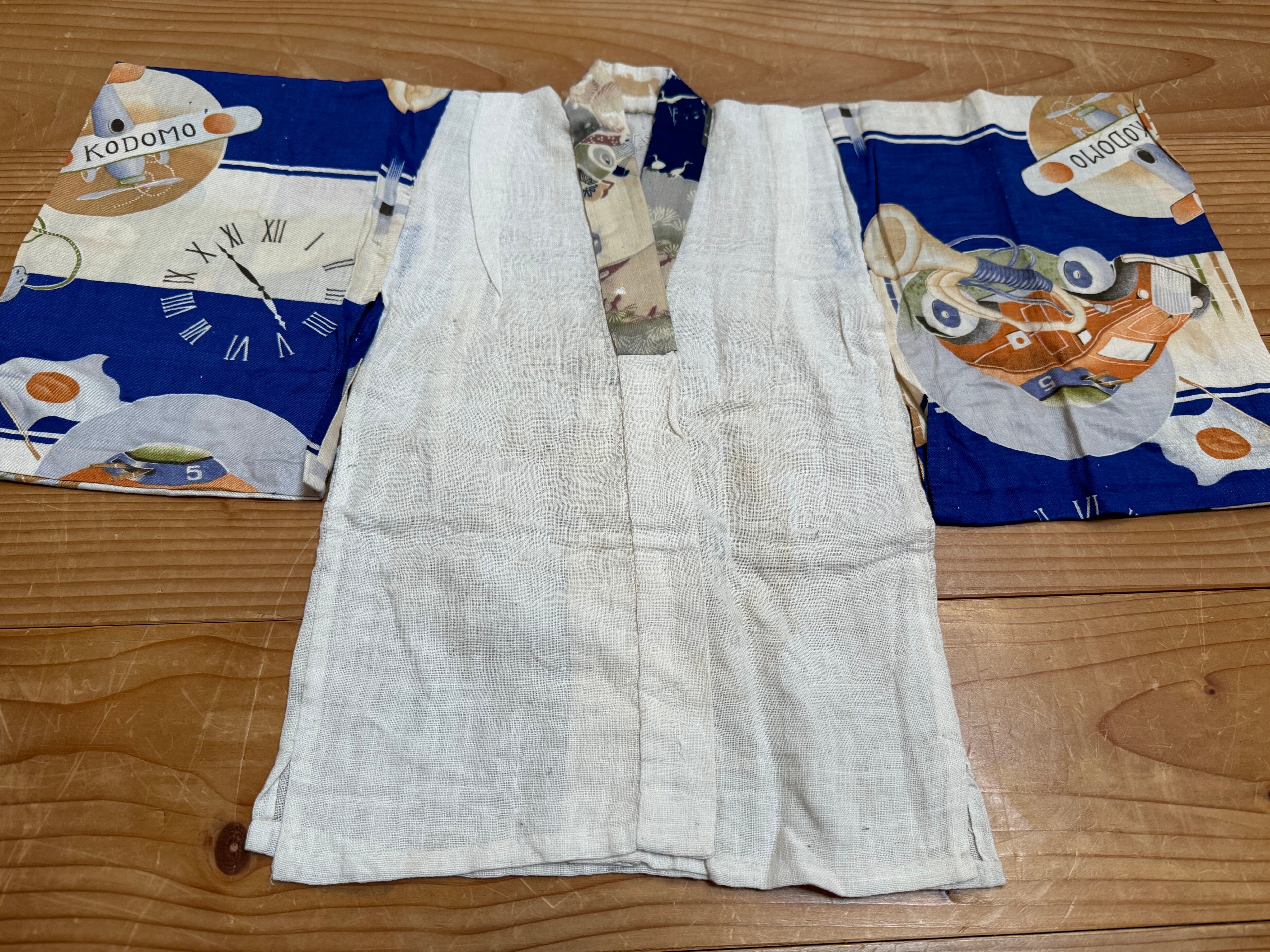 子どもの成長祝う産着などに、強さの象徴の軍事関連絵柄ー軍事と生活が