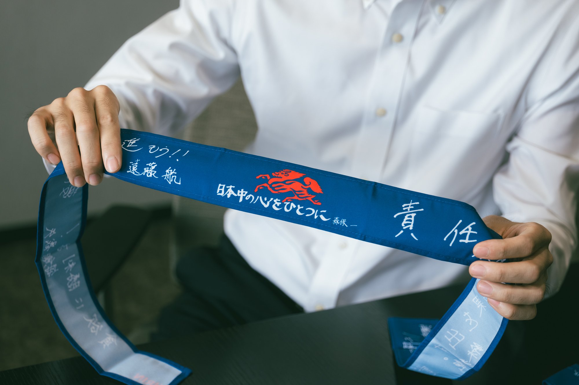 サッカーで日本中の心をひとつに。13万本の「勝利のハチマキ」が