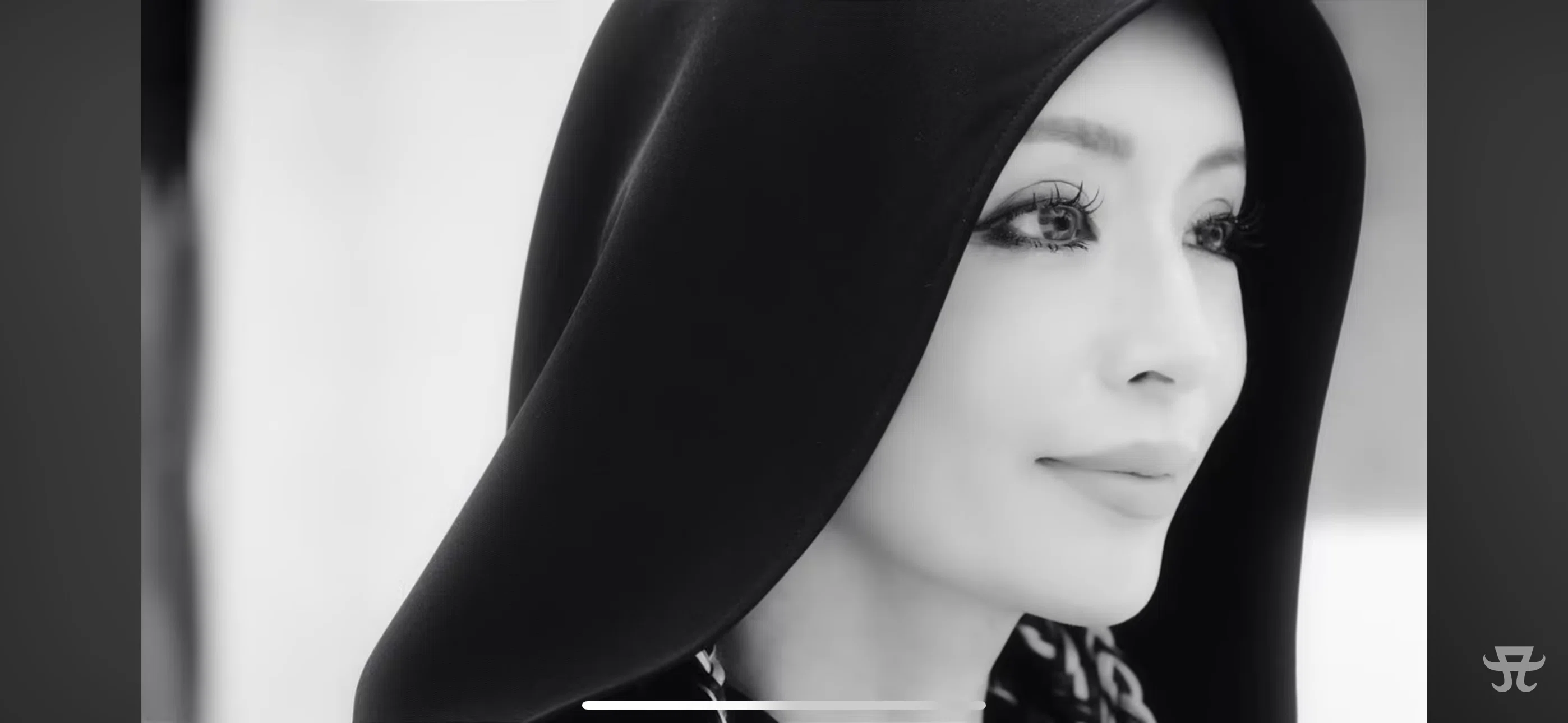 Ayu living in 2025, holding up 