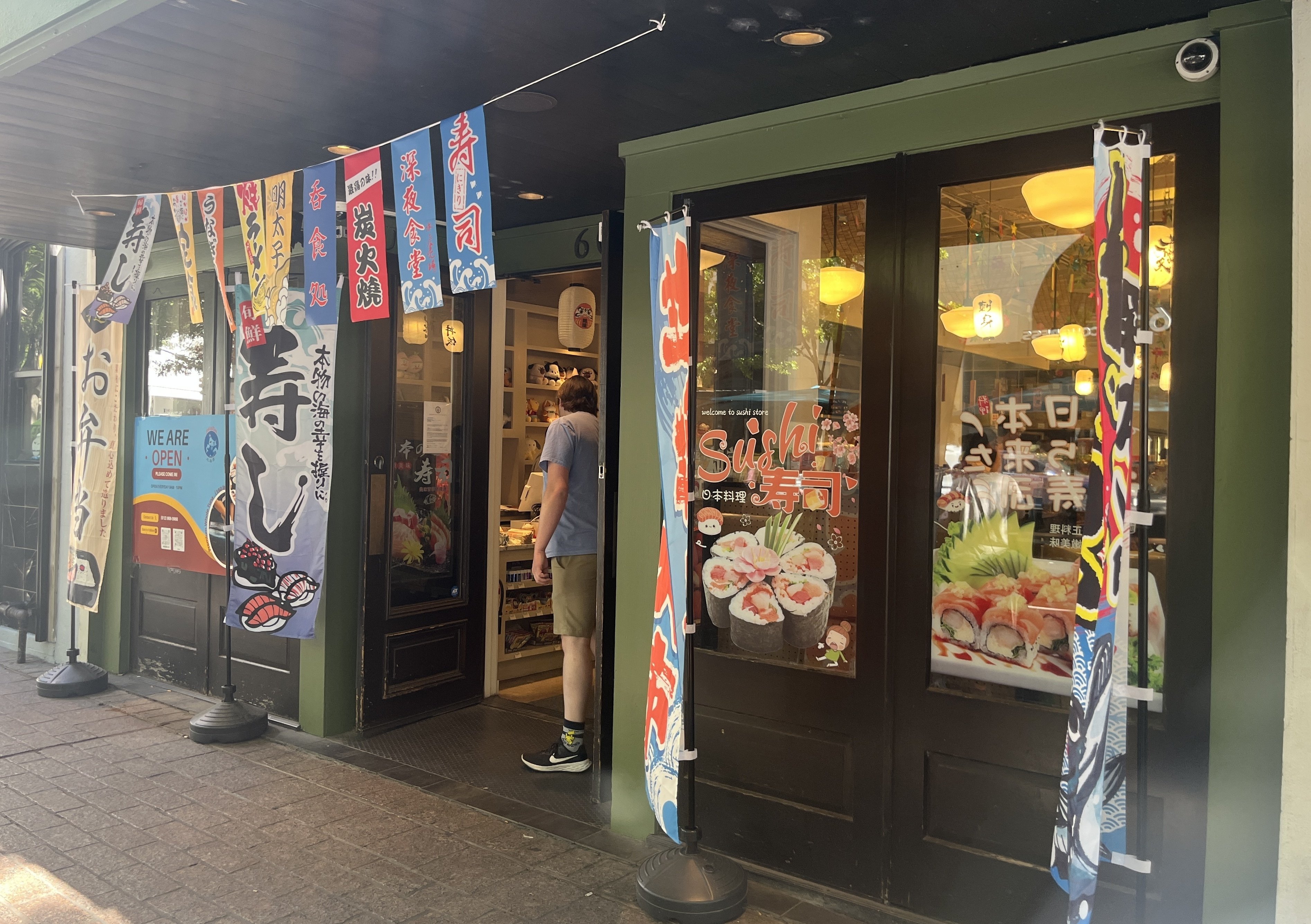 Colorful flags such as ``Sushi'' and ``Bento'' are landmarks.