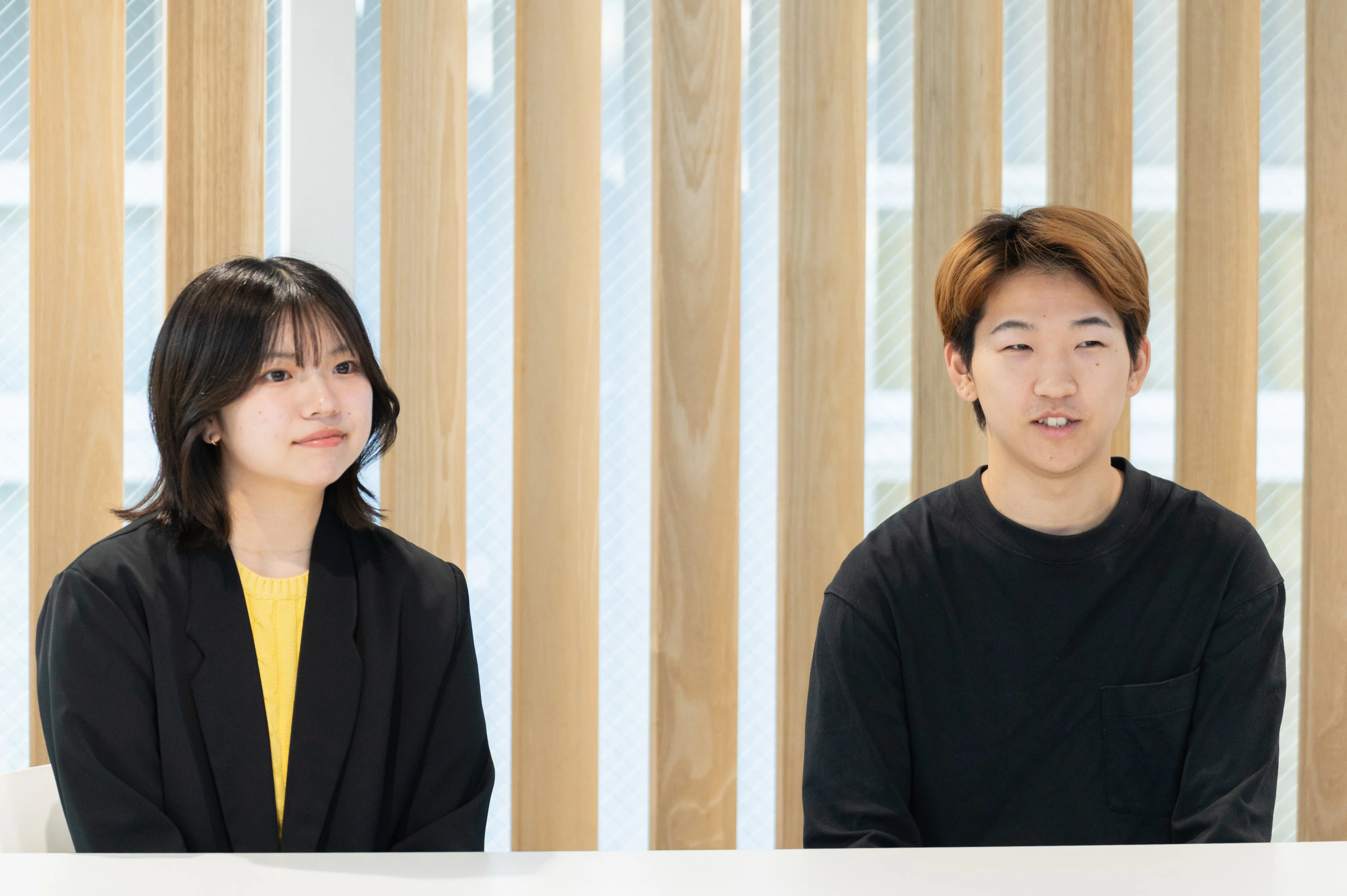 街とキャンパスをつなぐホップ。神奈川大学の学生とキリンが見つめる