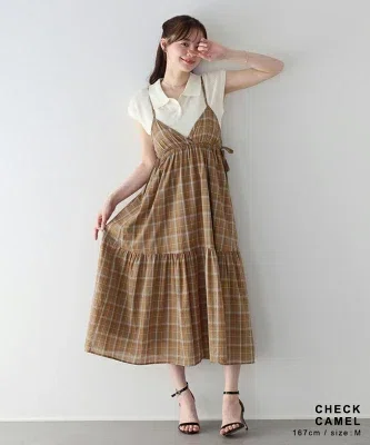 チェック柄生地を使ったティアードキャミワンピース。軽やかに広がるシルエットで春夏に着やすそうな一枚