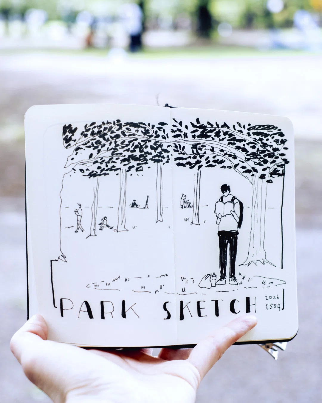 公園で立ち読みする青年のスケッチ｜A Life in Sketches no.0036