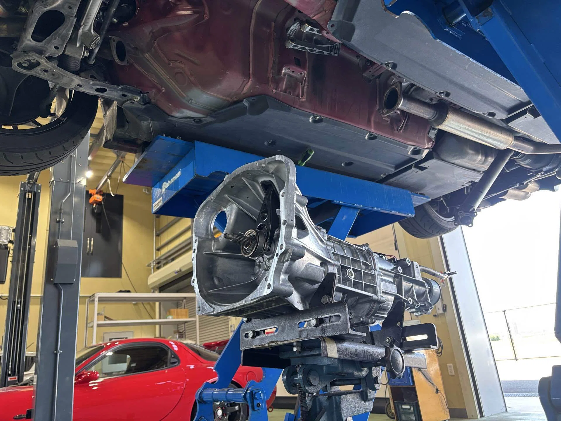 A mechanic's day off is spent tinkering with their own car. Gain A mechanic's day off is spent tinkering with their own car. Gain