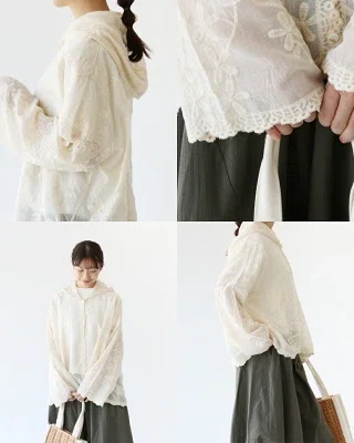花刺繍の入ったホワイト系の薄手フーディーシャツを使った普段着コーデ。日除けや冷房対策に使いやすく、ゆったりしたシルエットで体のラインを拾いにくい春夏向けの軽い羽織り