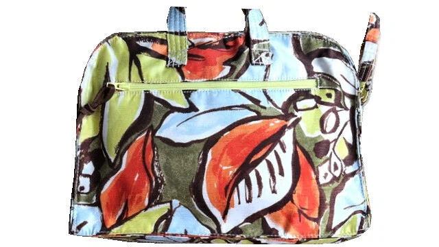This mini Boston bag features a warm, multi-colored botanical