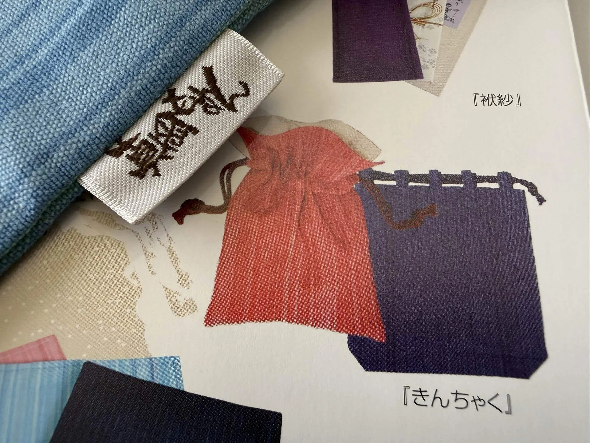 栃木県の伝統工芸品「真岡木綿の巾着袋とくし型小銭入れ」by メディア