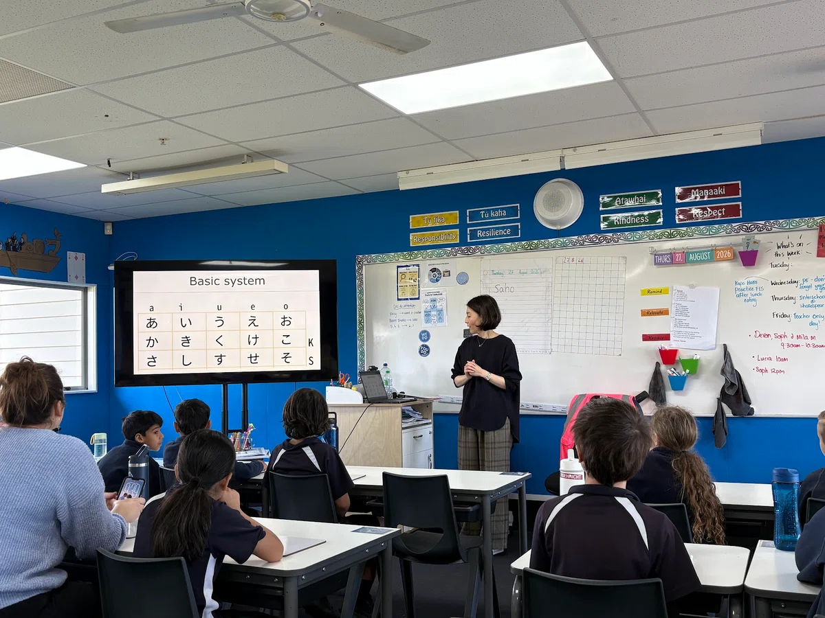 A Japanese-language lesson at Gulf Harbour School, with students seated in a classroom and an instructor at the front.