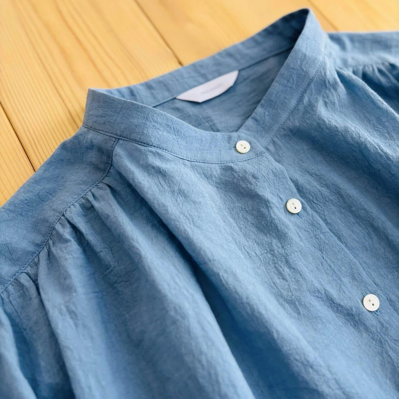 Stand-collar blouse with yoke gathers: It