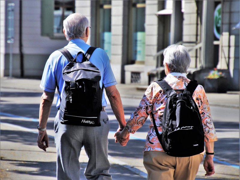 Canva - Senior Couple With Backpacks Walking Together - コピー