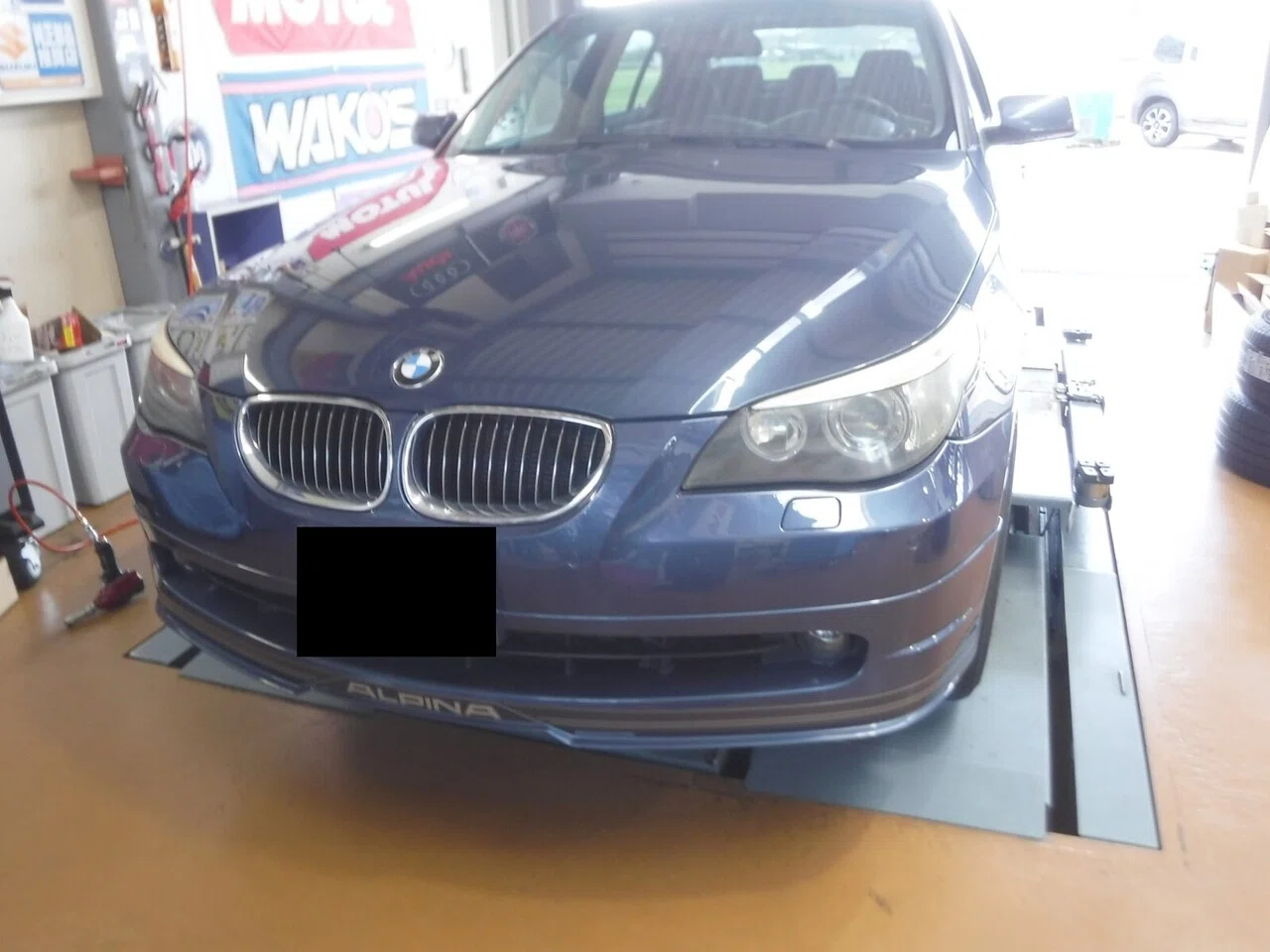 Cloudy headlights on an Alpina B5. Sanding them down to white, then ...