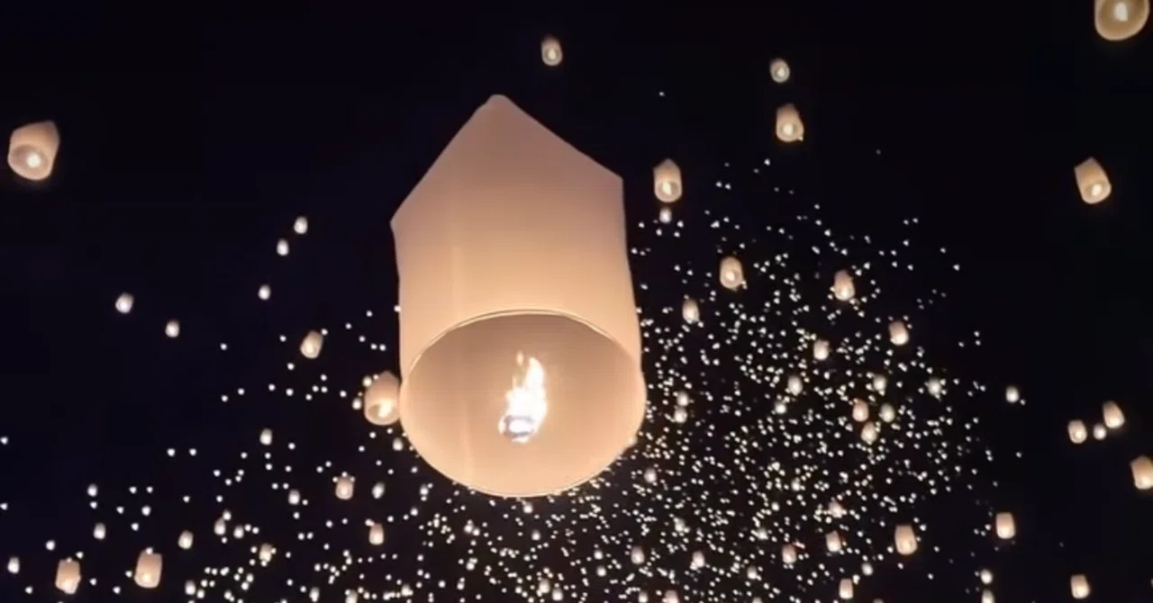 Thousands of lights filling the night sky. The Yi Peng Lantern Festival ...