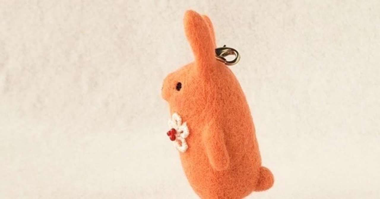 オレンジ色のニッコリうさぎストラップ Miz Fc Note