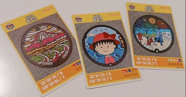 魚を見つめてたたずむ青い水鳥・かわせみ 大阪府和泉市Aのマンホール