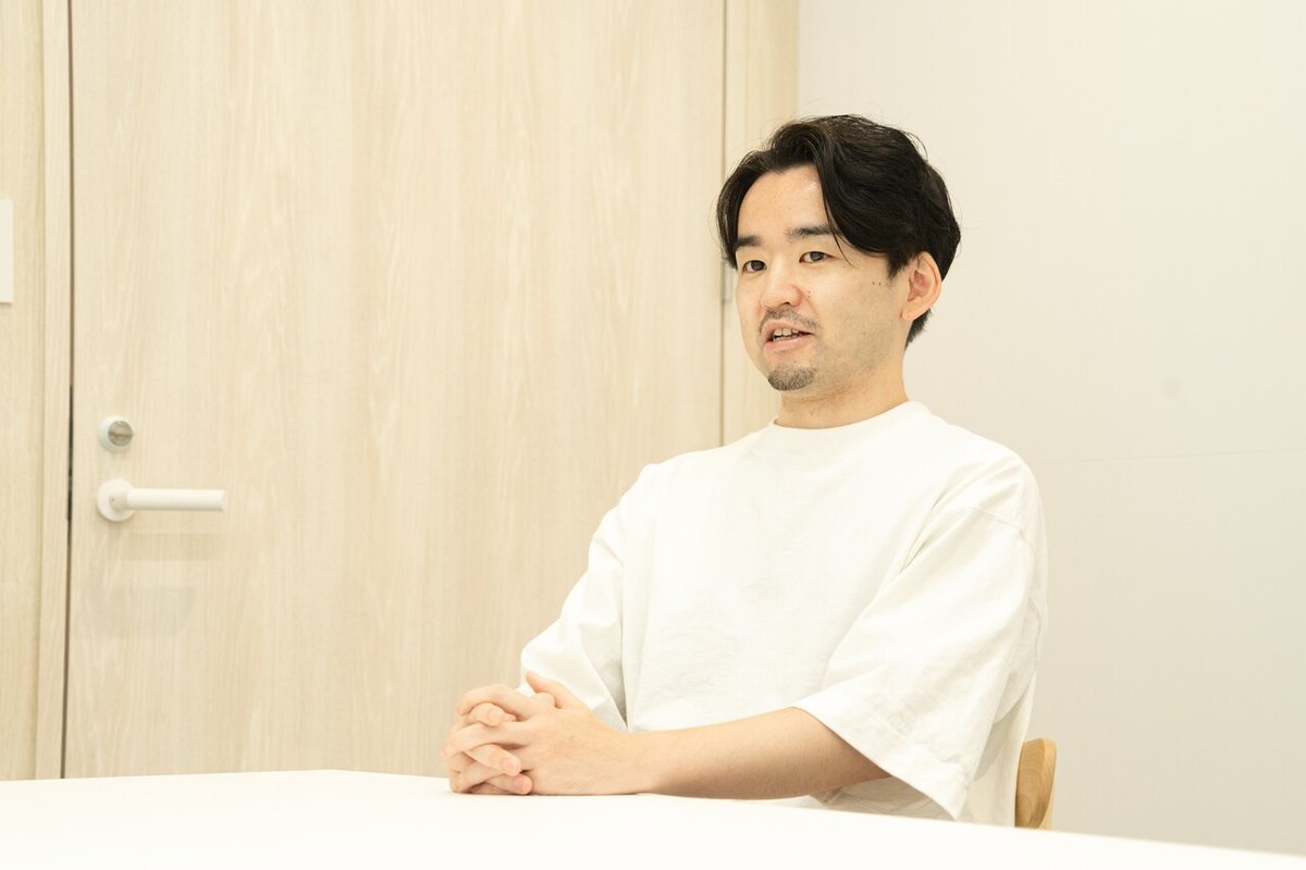 話している沢登さんの画像