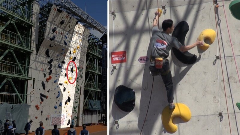 左手と右手それぞれでホールドに飛びつく片足の男子選手